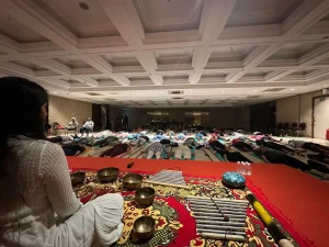 Sound healing session with singing bowls laid out in the hall at Jeevatman Yogshala, Rishikesh