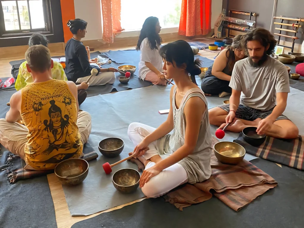 Sound healing group practice with Tibetan singing bowls in Rishikesh