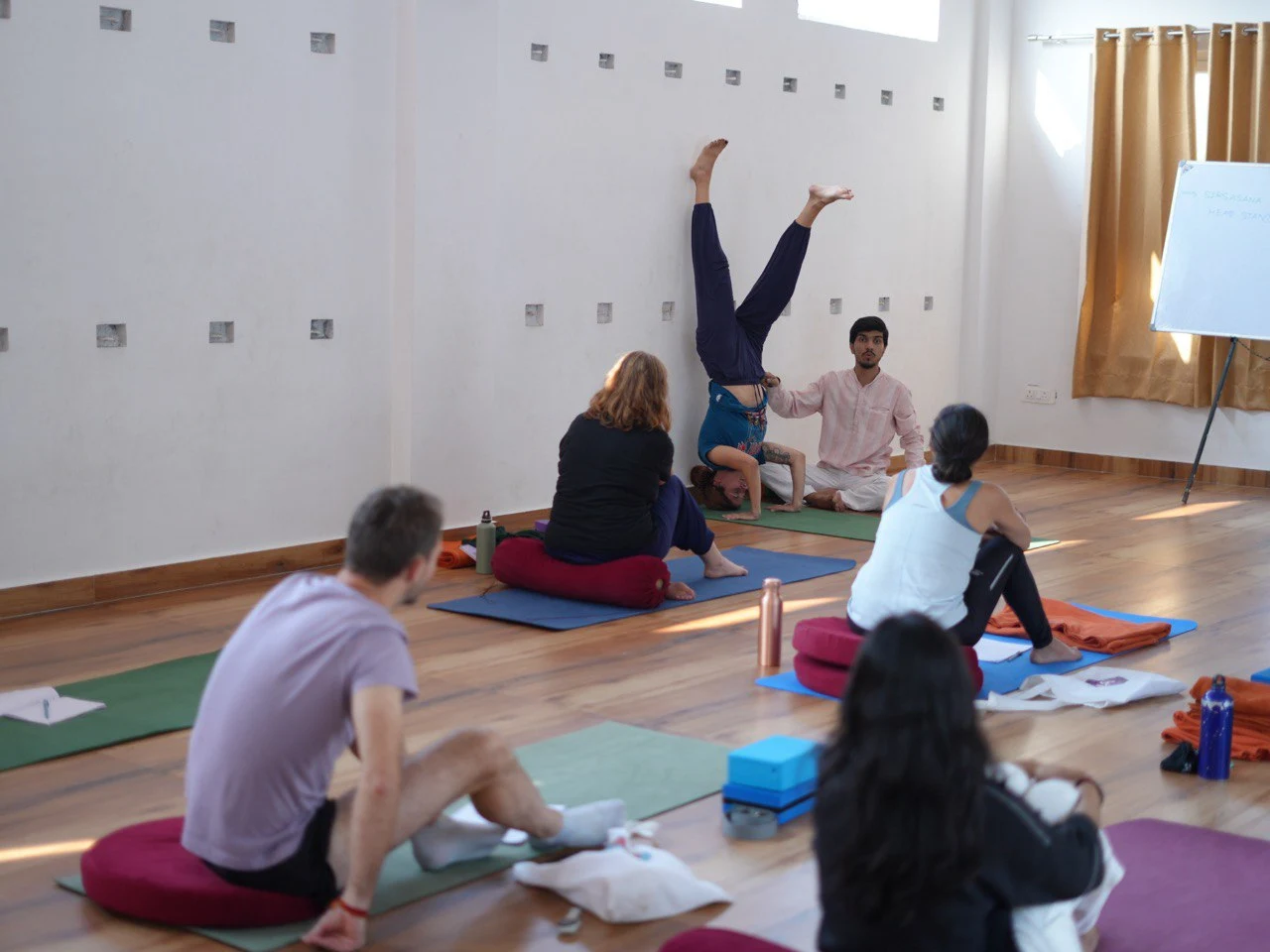 Traditional Himalayan yoga teaching with hands-on guidance in Rishikesh