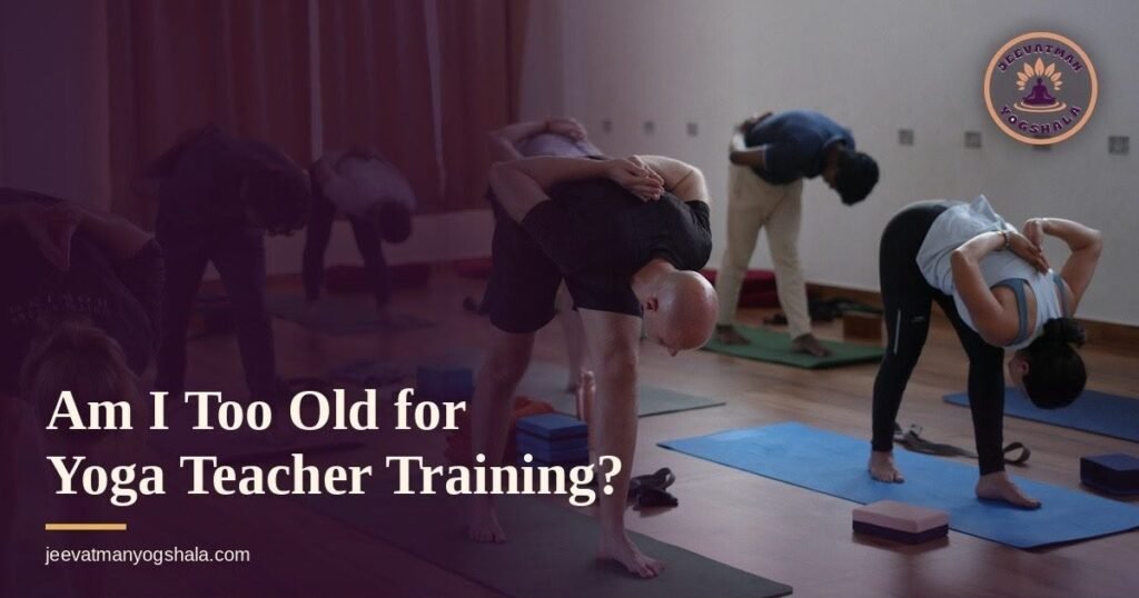 Older and younger students stretching together in a yoga teacher training class in Rishikesh, illustrating that age is not a barrier to training